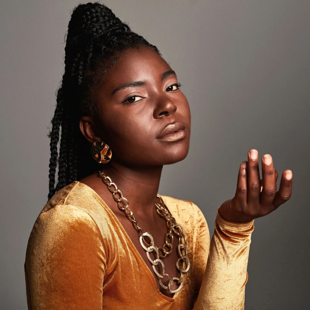 Shot of a beautiful young woman posing against a grey background
