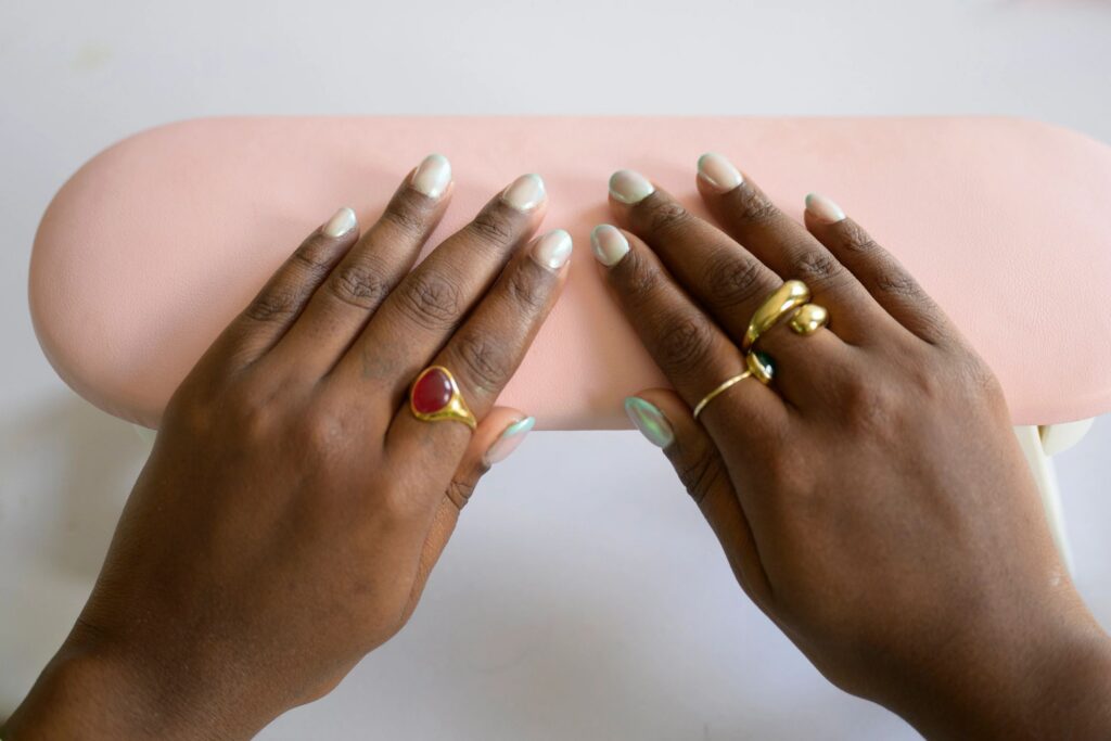 Overhead close-up of manicured hands of young black women